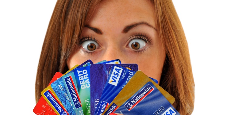 BRDJ1X Credit cards, woman holding lots of credit and debit cards. Image shot 09/2010. Exact date unknown.